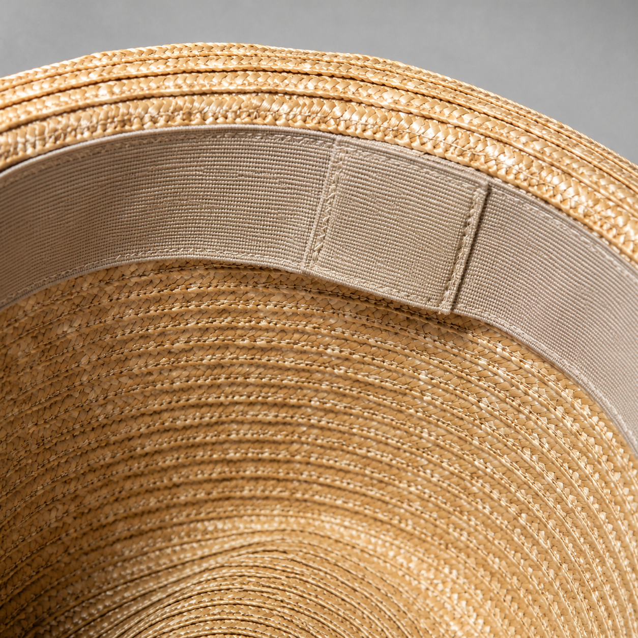 Straw hat interior sweatband material and stitching close-up