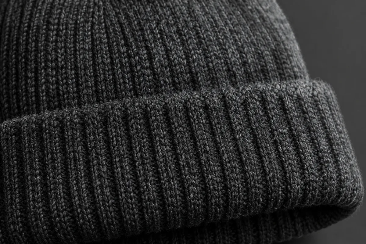 ribbed cuff band beanie close-up showing elastic stretch stitch pattern for wholesale buyer quality guide