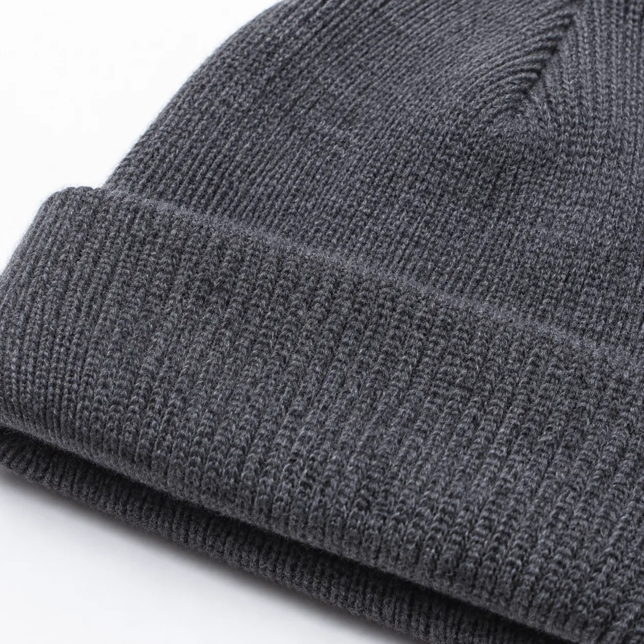 knitted beanie detail - yarn quality, linking seam, and pilling 